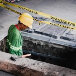 a man in a hard hat working on a construction site